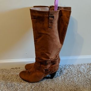 Brown heeled knee high boots